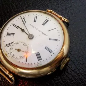 старинные золотые наручные часы  